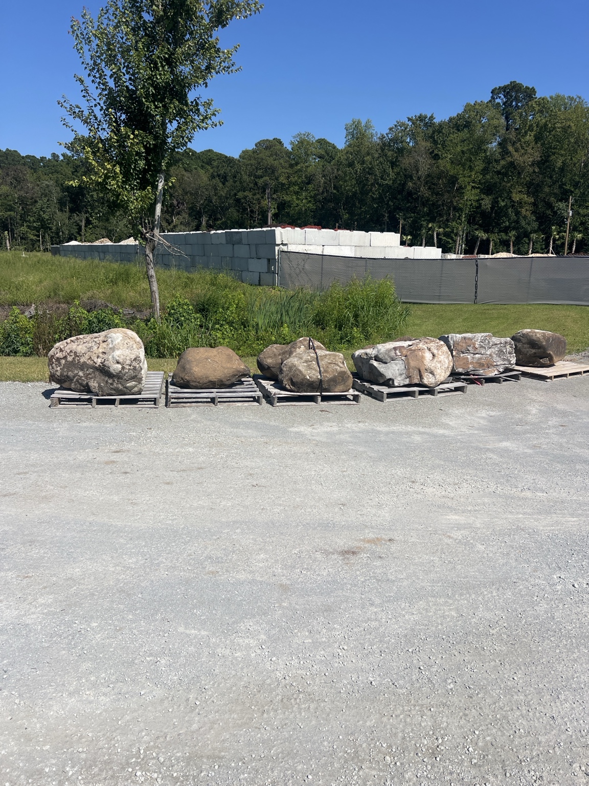 Large landscape boulders displayed on pallets at My Yard Center