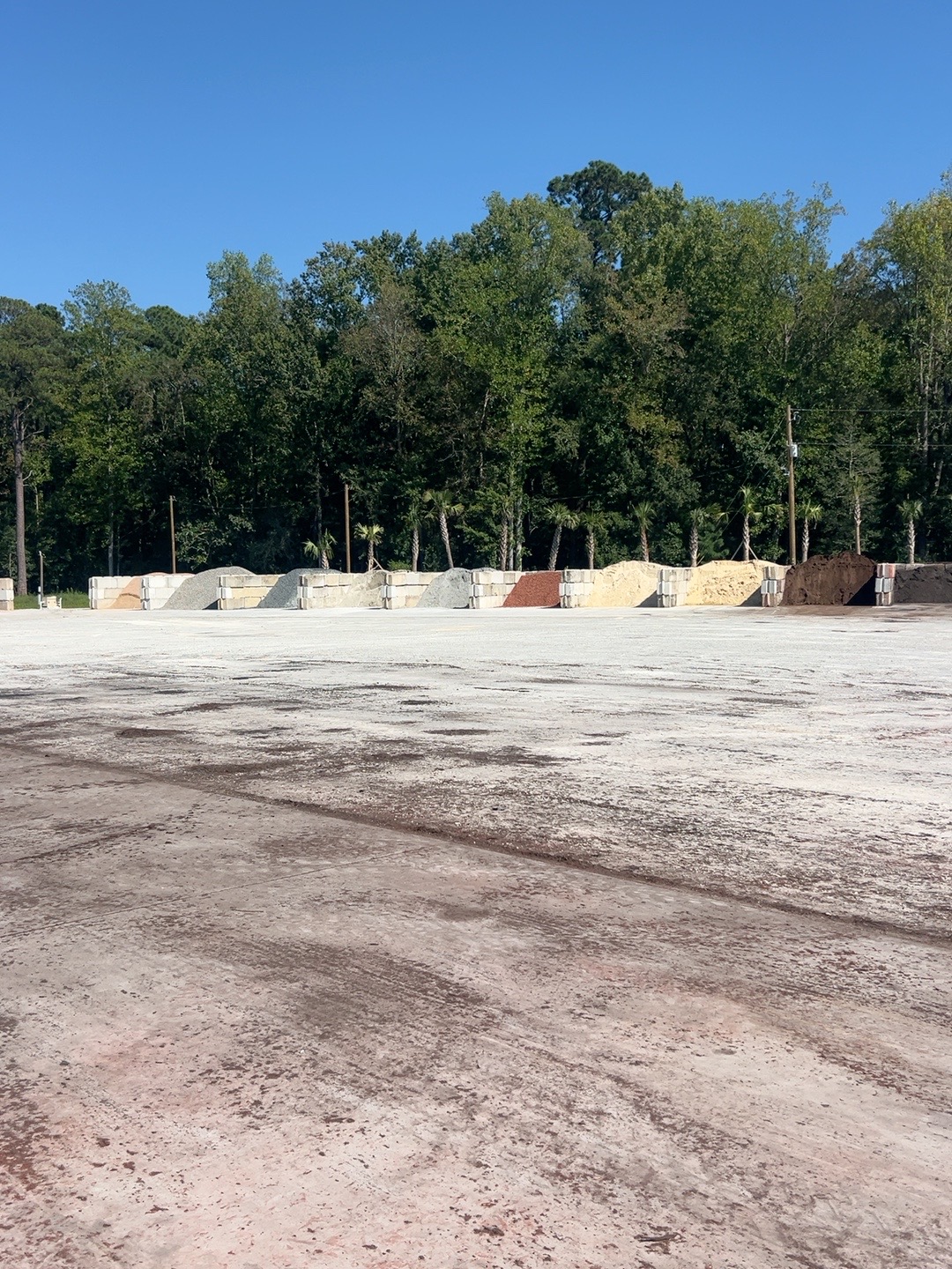 Rows of bulk rock, sand, soil and mulch bins at My Yard Center